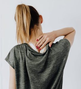 woman-holding-her-neck-after-automobile-accident-whiplash-injuries-Idaho-trial-lawyer-free-consultation-Chris-Caldwell-personal-injury-law